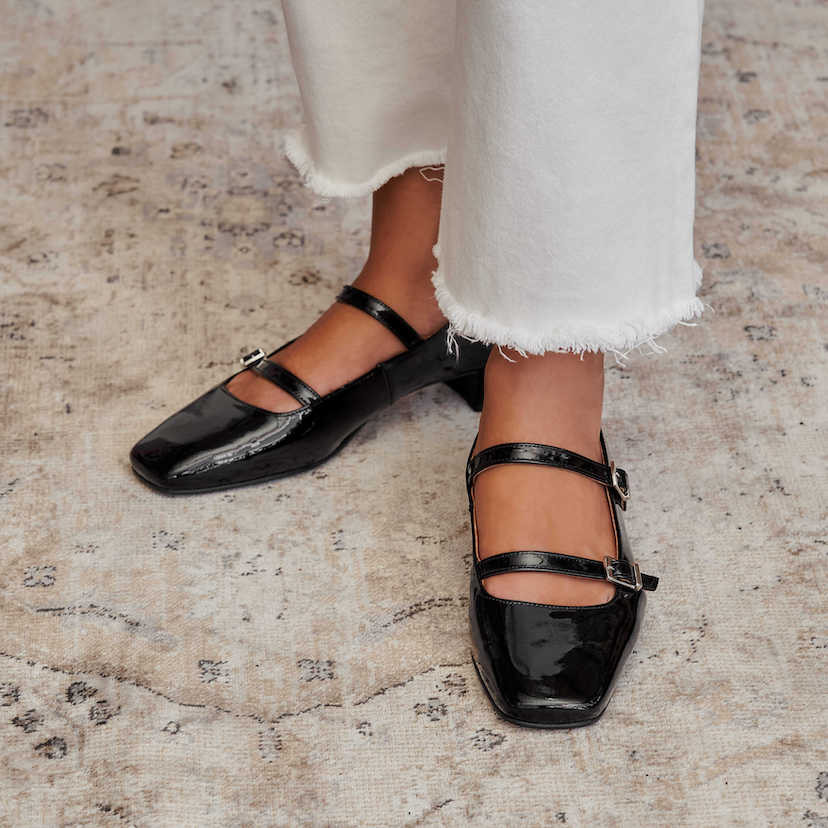 Black patent leather Lolina Mary Janes with perspective view and semi-open feet - MONPIEL