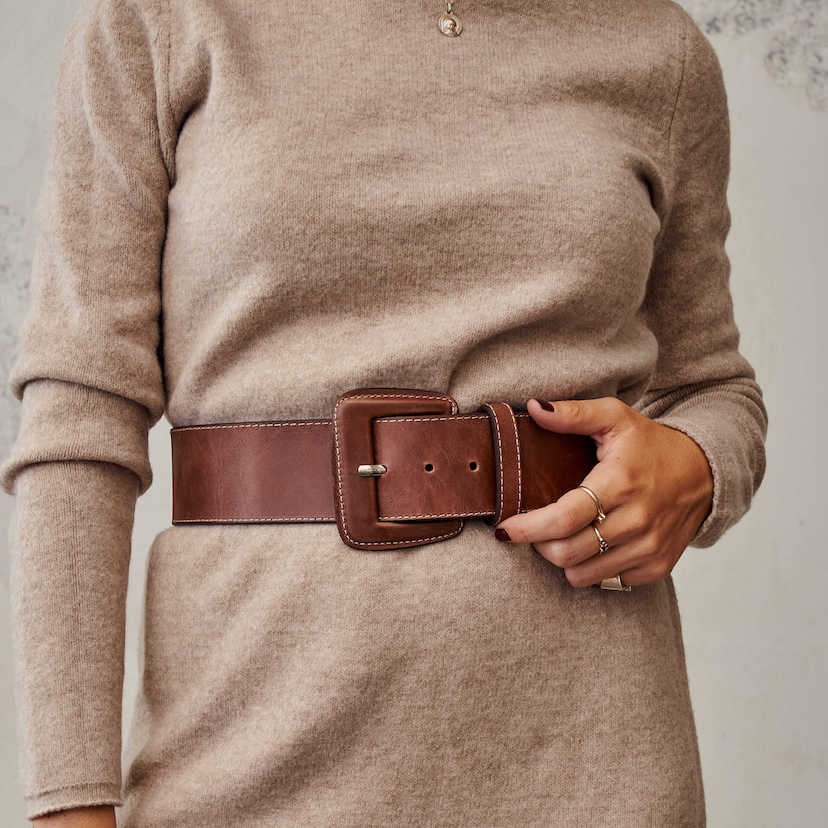 Extra wide belt with covered buckle in brown, worn over a dress - MONPIEL