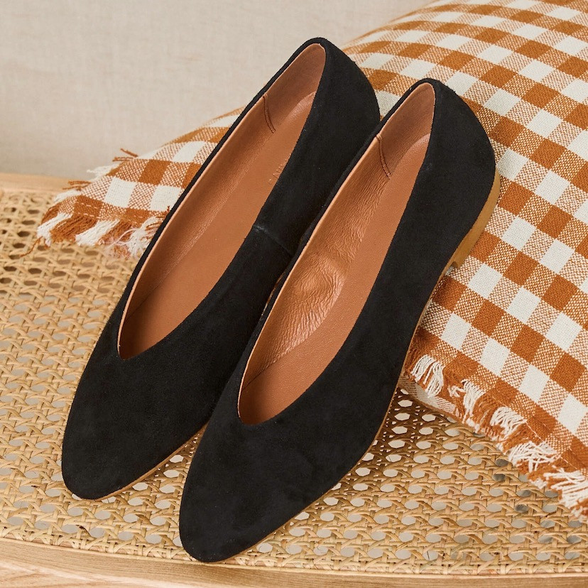 Black suede flat ballerina, perspective view, resting on a cushion - MONPIEL