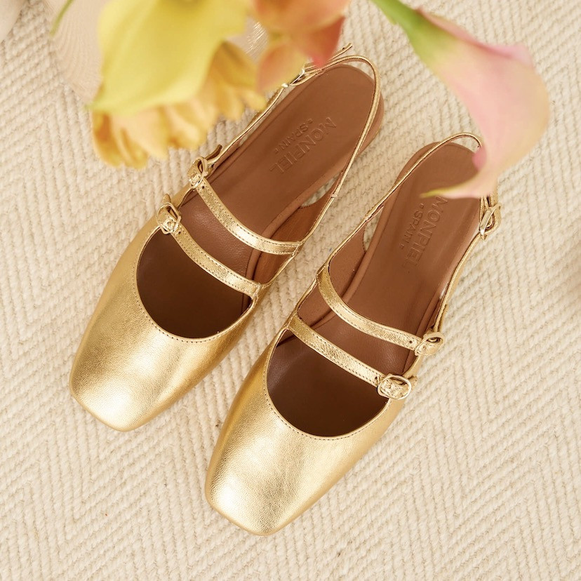 Gold Lolina backless Mary Janes, top view, resting on a carpet - MONPIEL