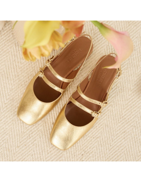 Gold Lolina backless Mary Janes, top view, resting on a carpet - MONPIEL