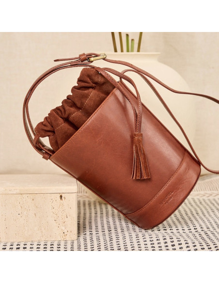 Small Havana leather round cube bag, front view, tilted, resting - MONPIEL