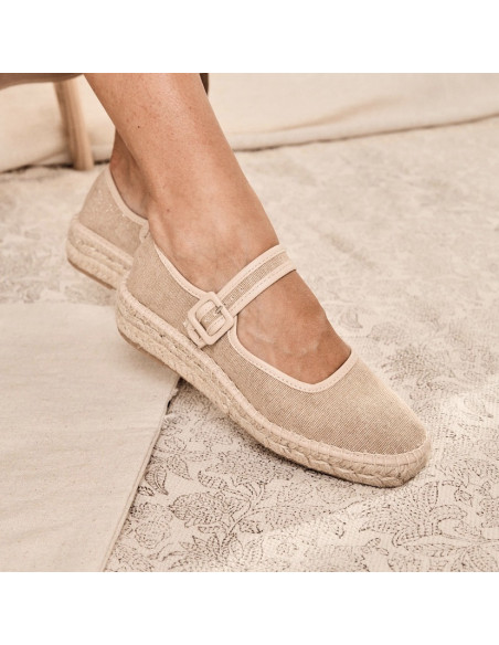 Beige shiny Cuba Mary Jane espadrille, side view on a carpet - MONPIEL Beige shiny Cuba Mary Jane espadrille, side view on a carpet - MONPIEL