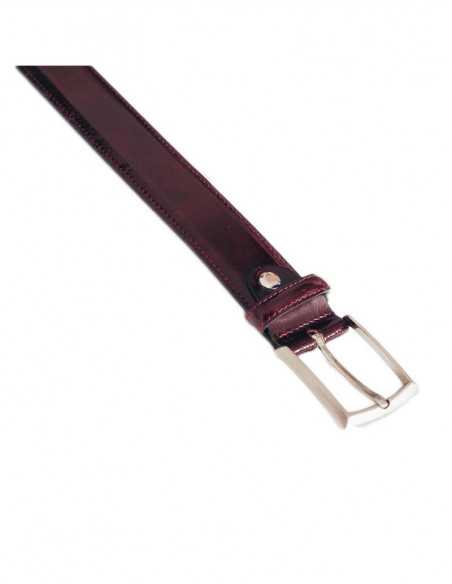 Side view of the burgundy leather belt with a classic metal buckle - MONPIEL