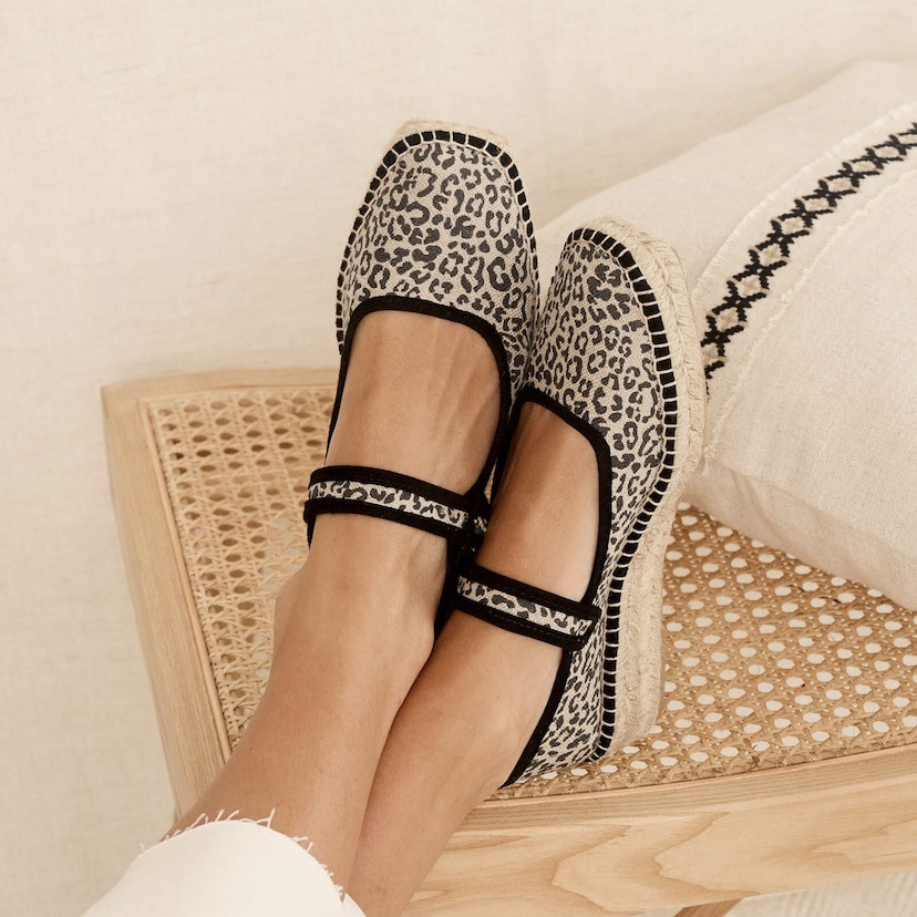 Cuba leopard print Mary Jane espadrille in black leopard canvas with crossed feet on bench - MONPIEL