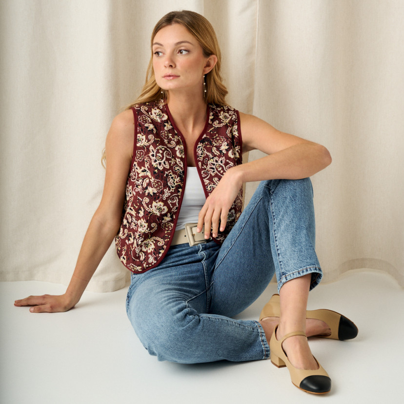 Charlotte pointed Mary Jane in beige, model seated on the floor, leg crossed over - MONPIEL