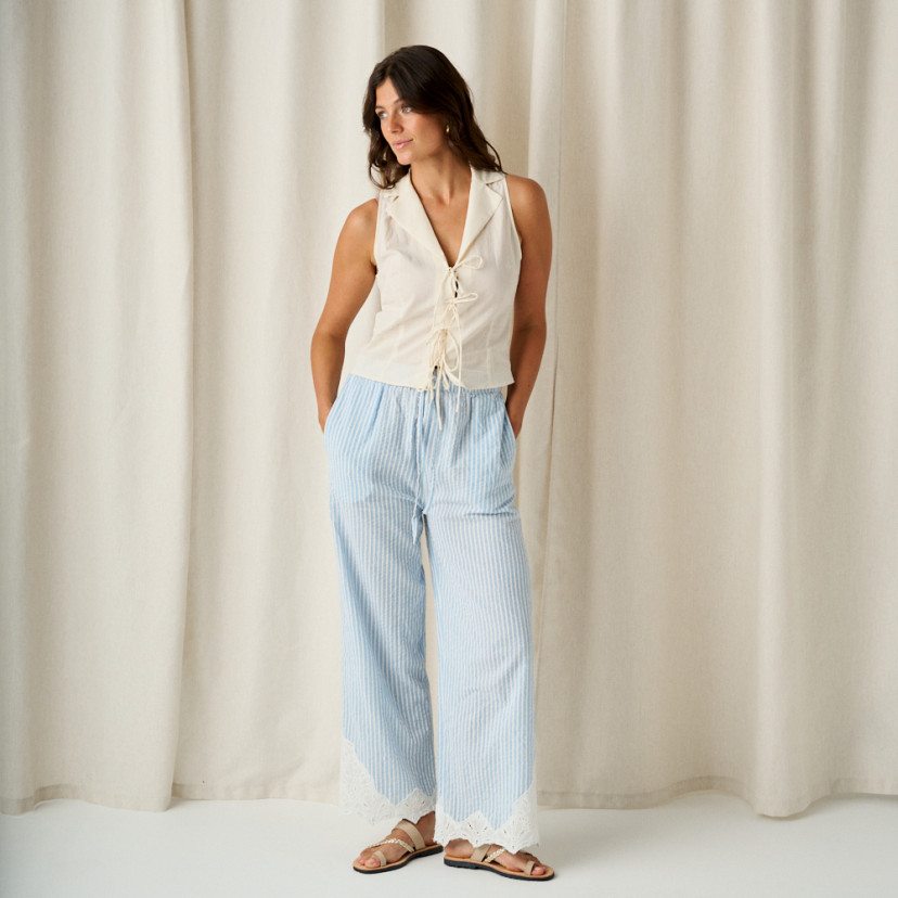 Mykonos Greek leather sandal in ice color, full shot of model standing - MONPIEL