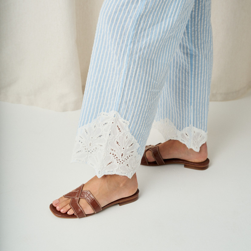 Carmina leather toe-post sandal in coco leather, perspective view, striped pants - MONPIEL