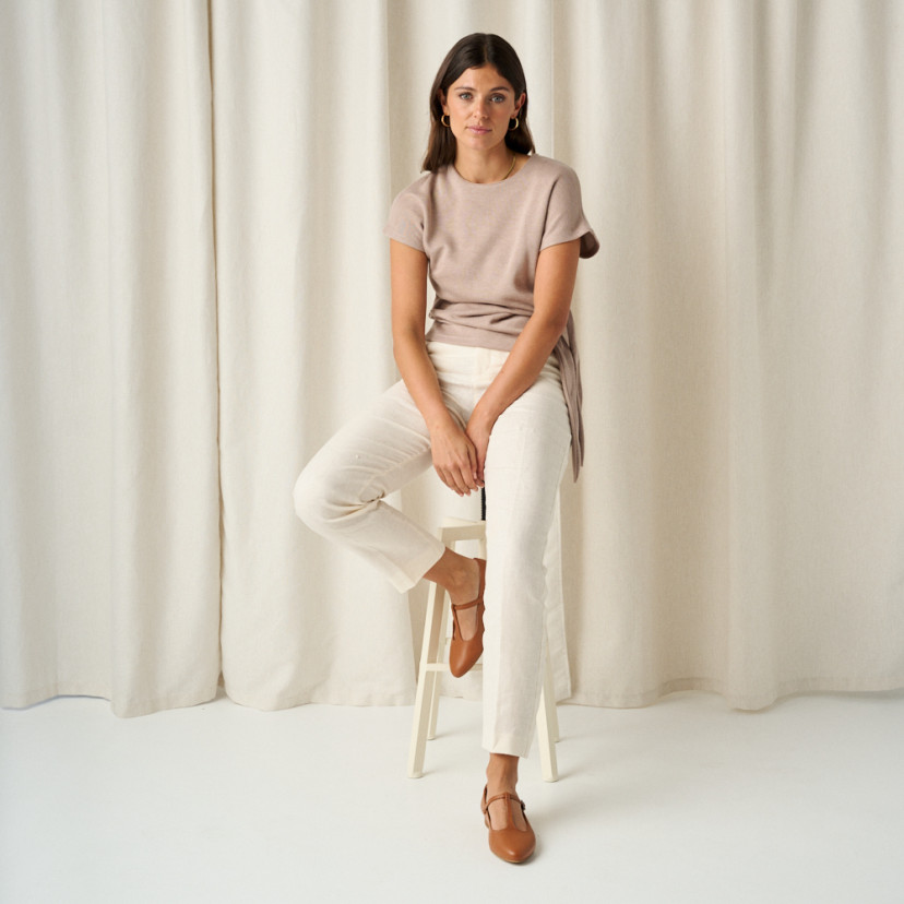 Women's Mary Janes Marieta in leather color with foot resting on stool and full shot of the model sitting - MONPIEL