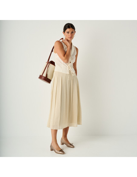 Manuela low heel bow flat slipper in cappuccino bronze with perspective view, full shot of the model with bag on shoul - MONPIEL