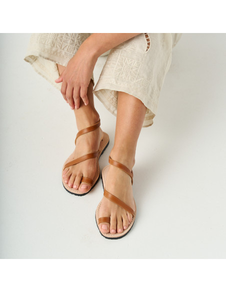 Milos leather sandal with straps in leather color, front view on white floor - MONPIEL