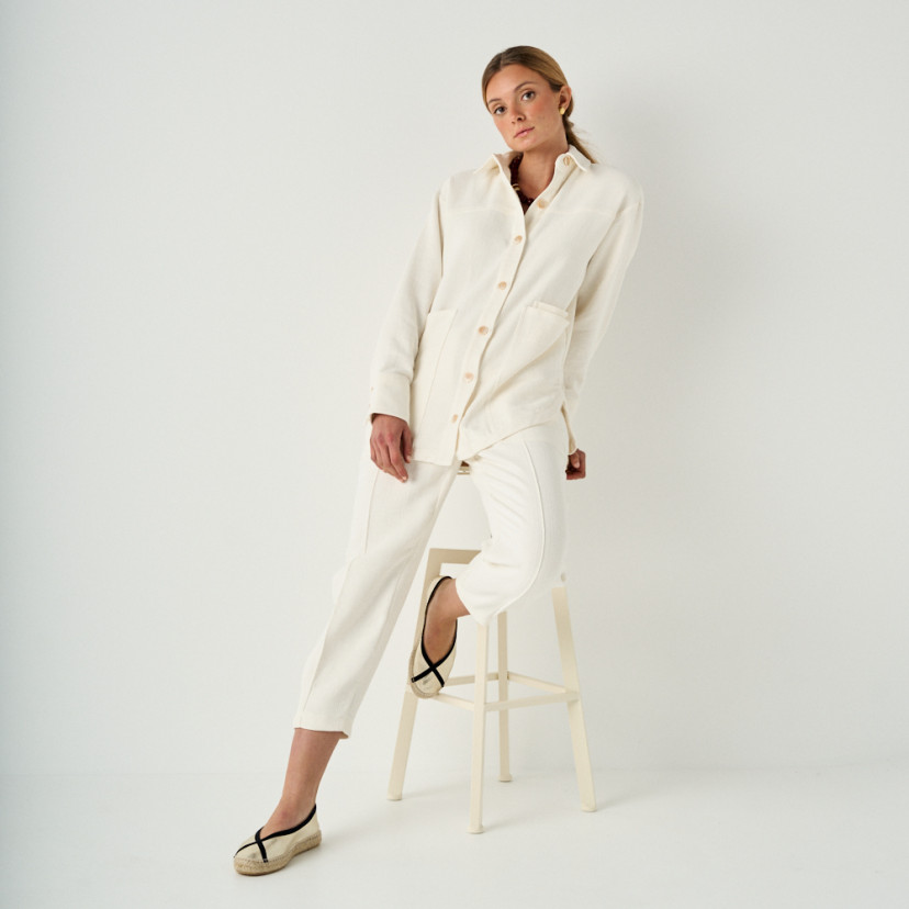 Gaia platinum ballerina espadrille, full shot of the model resting on a stool - MONPIEL