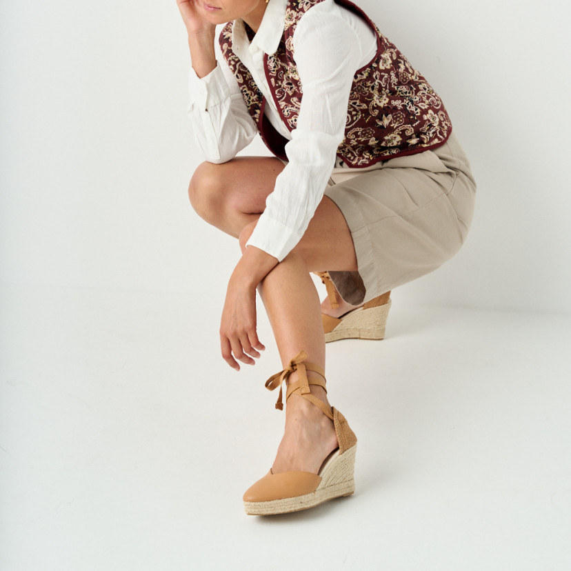 Elba camel leather wedge espadrille with perspective view, model crouching, full shot - MONPIEL