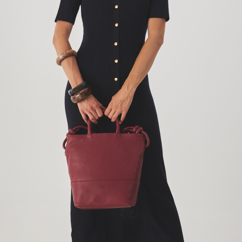 Large burgundy leather knot handbag with front view and full-length shot - MONPIEL