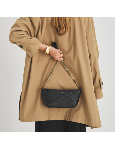 Small black New York quilted leather bag for women, front view, held on the back - MONPIEL