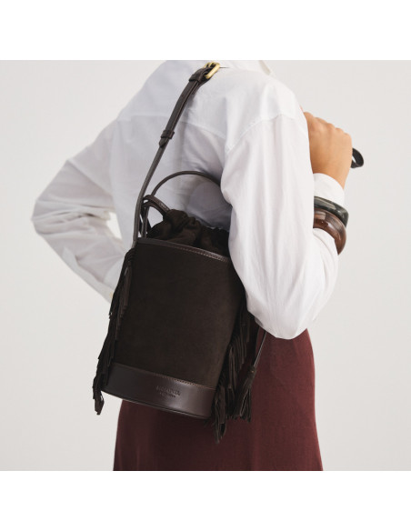 Small Roma leather fringe bucket bag in brown suede, front view, hanging on the back - MONPIEL