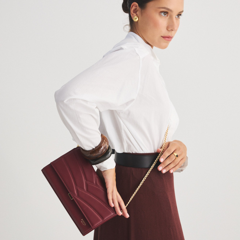 Venice burgundy leather handheld purse for women, worn crossbody, mid shot - MONPIEL
