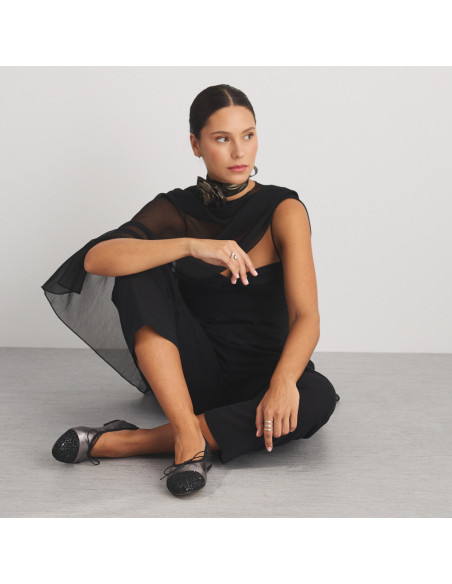 Valeria silver glitter-toe flat shoe, front view of model sitting on the floor, wide shot - MONPIEL