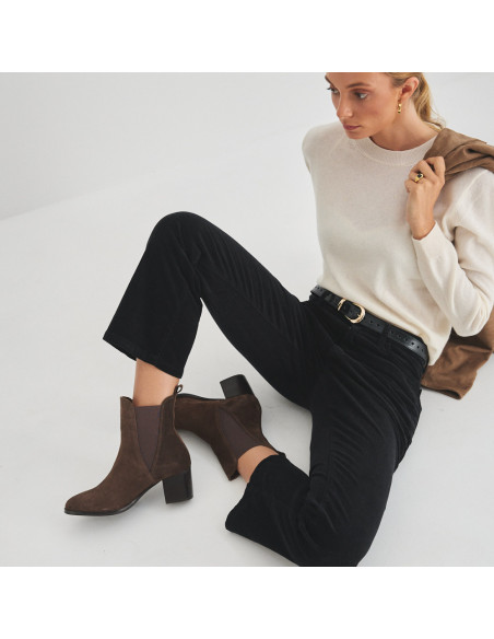 Marcela leather ankle boot in brown suede, overhead and side view, model sitting on the floor - MONPIEL Marcela leather ankle boot in brown suede, overhead and side view, model sitting on the floor - MONPIEL