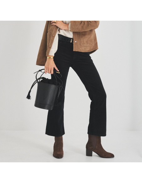 Marcela leather ankle boot in brown suede, mid shot with bucket bag held in hand - MONPIEL Marcela leather ankle boot in brown suede, mid shot with bucket bag held in hand - MONPIEL
