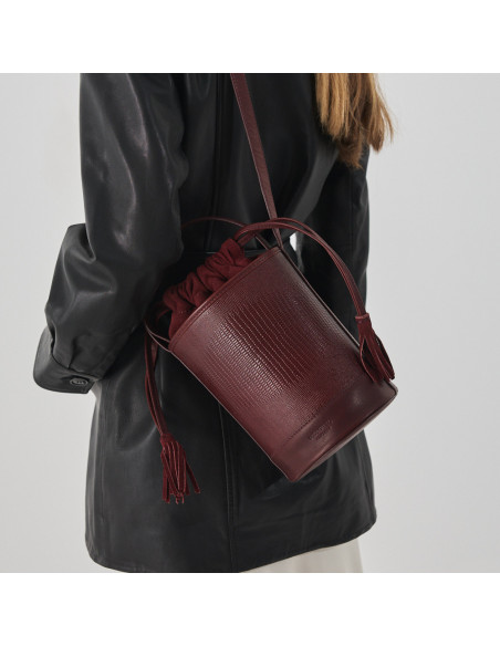 Small round burgundy snakeskin leather bucket bag, hanging on the shoulder - MONPIEL