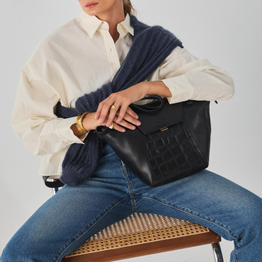 Brown leather women's tote bag Paris Coco, front view, resting on the armchair - MONPIEL 2