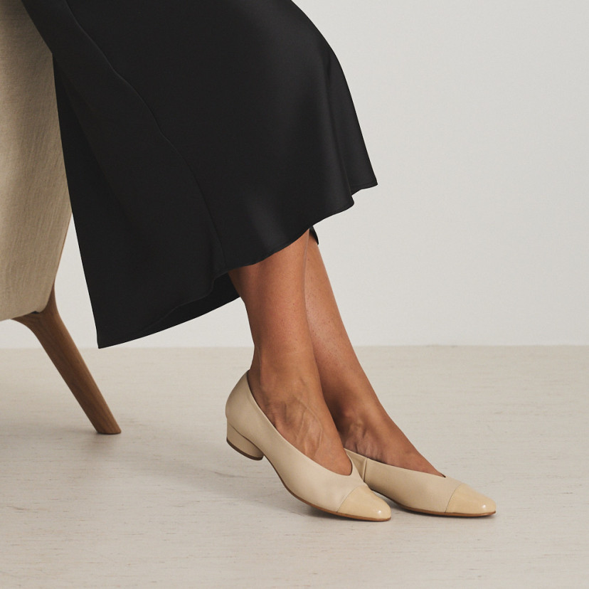 Ballerina in beige/charol beige leather bicolor heeled ballerina with profile view sitting on armchair - MONPIEL