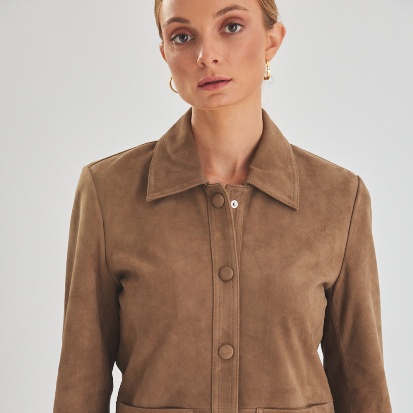 Women's leather jacket with covered buttons in tobacco colour with button detail in the foreground - MONPIEL