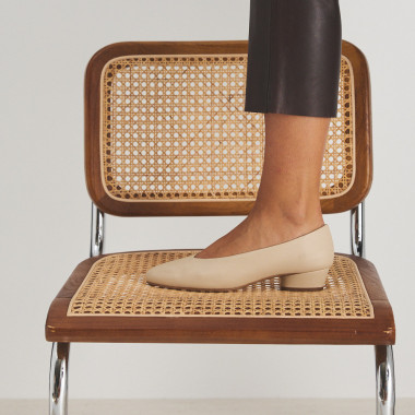 Tan leather heeled ballerinas resting on grey trays, side perspective view - MONPIEL 2