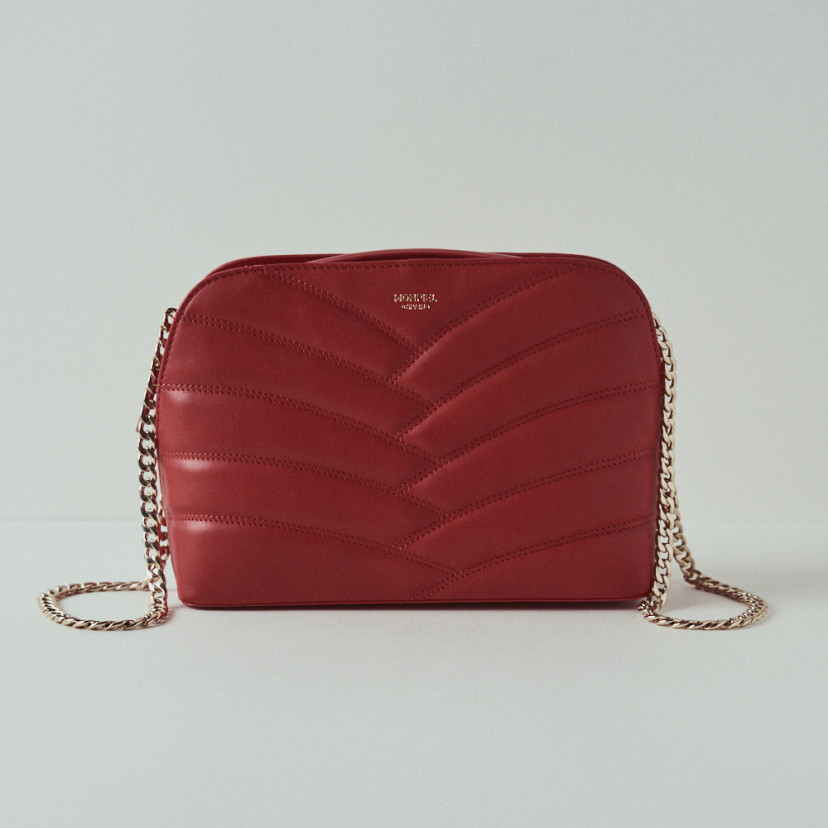 Quilted leather bag with gold chain in red, front view with white background - MONPIEL