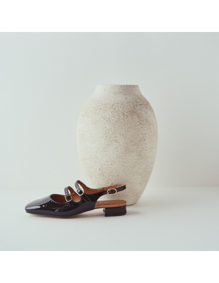 Lolina backless Mary Jane in black with side view in front of the vase - MONPIEL