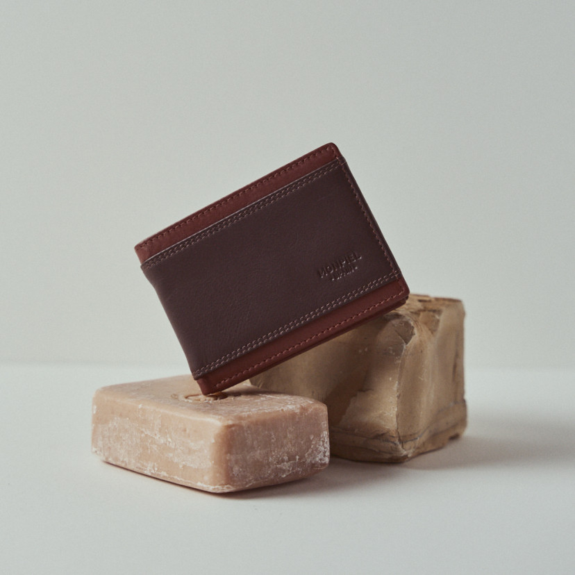 Small American-style lake wallet without coin pocket in brown leather resting on soap - MONPIEL