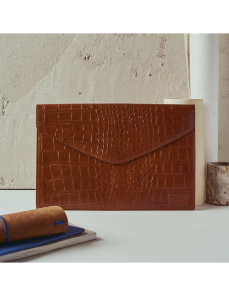 Elegance Coco leather laptop sleeve in tan, front view, resting on a vase - MONPIEL