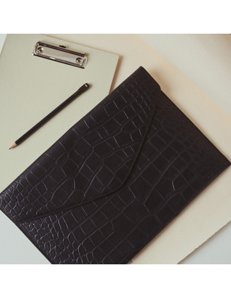 Elegance Coco leather laptop sleeve in black, top view, resting on the table - MONPIEL