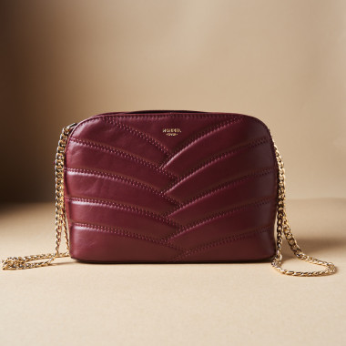 Quilted leather bag with gold chain in tan color, next to soap - MONPIEL 2