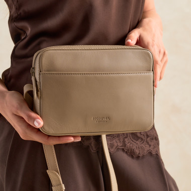 Basic black crossbody bag, front view hanging on a chair - MONPIEL 2